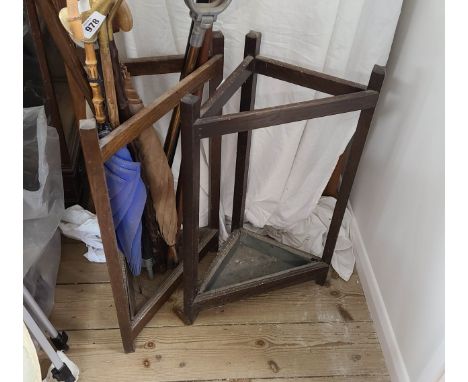 A pair of vintage stained oak corner stick stands