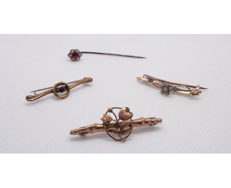 Two marked 9ct. yellow metal bar brooches and another of varying design - sold with a stick pin