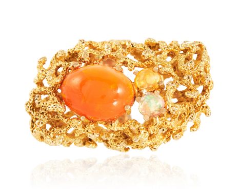 A VINTAGE FIRE OPAL AND OPAL COCKTAIL RING in high carat yellow gold, set with a trio of cabochon opals within a textured, op