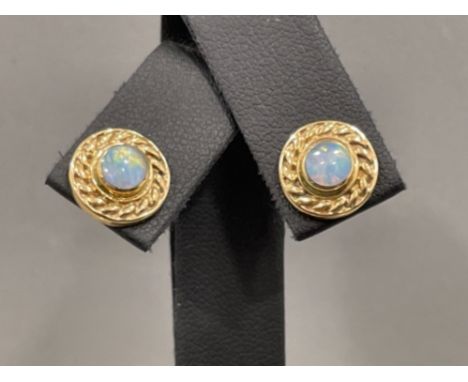 9ct gold ornate Opal stud earrings featuring round Opal with rope edge design