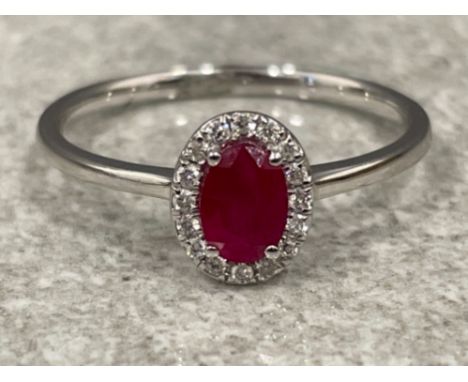 18ct white gold Ruby and Diamond ring. .55cts size O