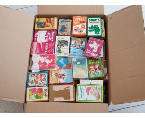 Box containing a large quantity of vintage playing cards, most in original cardboard packs