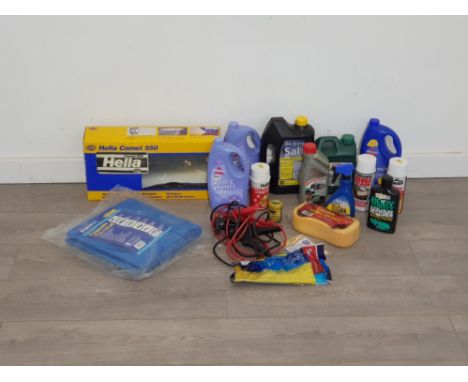 Hella comet 550 light system for car along with various cleaning products and car polish  set of jump leads and tarpaulin