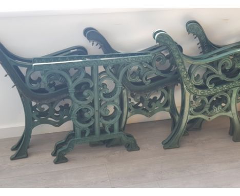 A total of 4 cast iron bench ends and 1 pair of table ends, vintage and painted in the standard garden green