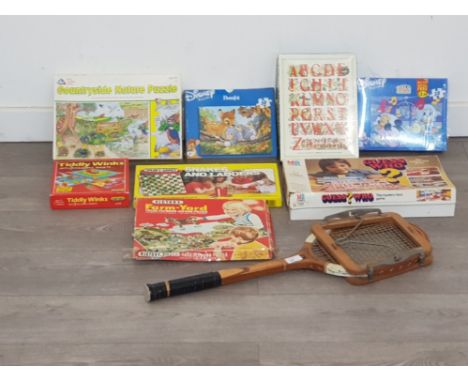 8 board games to include guess who snakes and ladders and tiddly winks etc along with a vintage dunlop tennis racket
