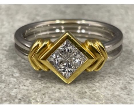 Ladies 18ct white gold Diamond ring. Comprising of 4 princess cut diamonds set in square of 18ct yellow gold