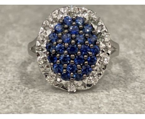 Ladies 18ct white gold Blue stone Diamond cluster ring. Size P 5.14g