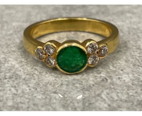 Ladies 18ct gold Emerald and Diamond ring. Featuring a round cut Emerald set in centre with 3 round brilliant cut diamonds on