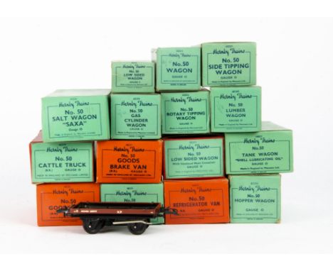 Boxed Hornby O Gauge Post-War No 50 Freight Stock,  a similar lot, with three in all-red boxes, 2 red boxes with green labels