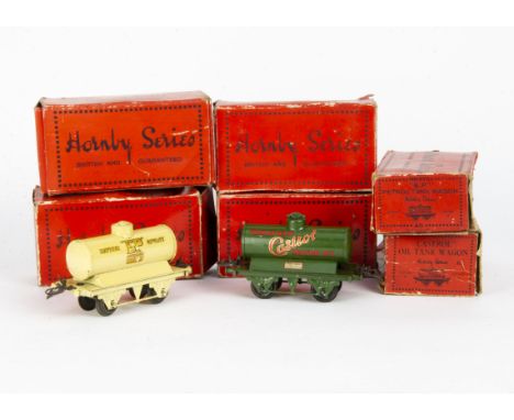 Boxed Hornby O Gauge Pre-War Tank Wagons,  red 'Shell' (2), green 'Castrol' (2), cream 'Motor BP Spirit' (large gold BP versi