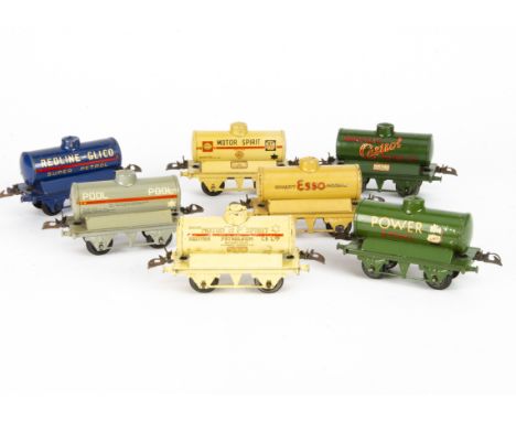 Seven Unboxed Hornby O gauge Pre-War Tank Wagons, all on 'T3' bases, a blue Redline-Glico, green 'Power Ethyl' and 'Castrol',