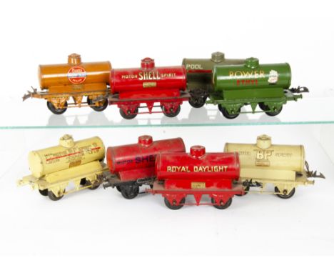 Hornby O Gauge Petrol Tank Wagons, all with 'T3' bases, comprising a circa 1930-1931 cream 'Motor BP Spirit' no 1404 with sma