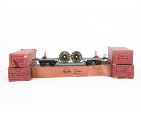 Boxed Hornby O Gauge Wartime-Issue Freight Stock, comprising a bogie Trolley Wagon in grey/red with 2 cable drums, box dated 