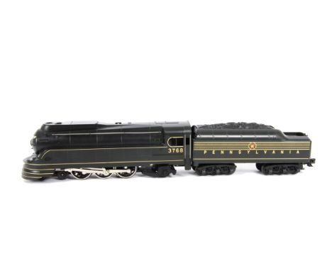 A Rail-King American 0 Gauge 3-rail electric 'K-4s' Class 4-6-2 'Torpedo' Locomotive and Tender, ref 30-1118-1, in Pennsylvan