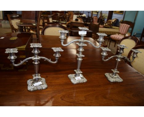 Set of three graduated silver plated candelabra, the largest height approx 34cm