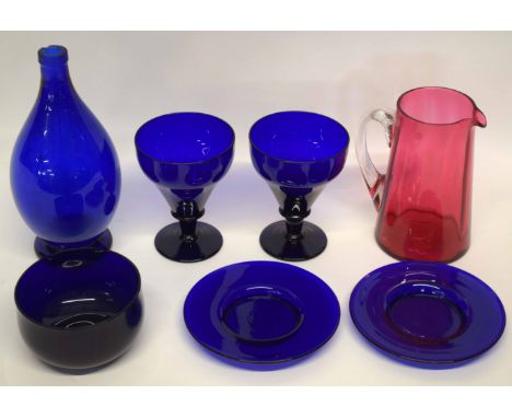 Quantity of blue coloured glass together with a ruby coloured jug, the blue ground glass comprising large bottle, two dessert