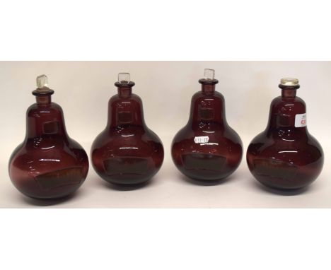 Group of four ruby coloured glass chemists jars, globular shape, with stoppers, (4)