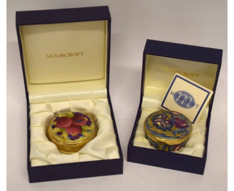 Enamel box and paperweight by Moorcroft in original boxes, one decorated with pomegranates, the other with flowers