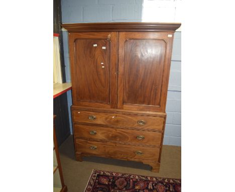 19th century mahogany converted linen press, two panel doors over three full width graduated drawers on bracket feet 1.31m wi