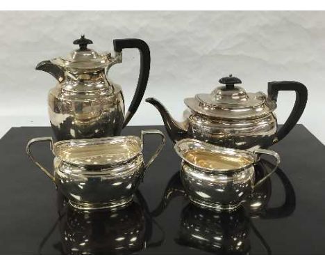 A silver four piece tea service, Atkin Brothers, the hot water jug 1937, the others 1939, approximately 1833g gross. (4)