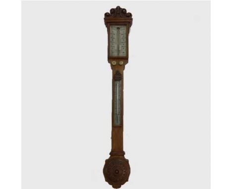 A nineteenth  century carved oak stick barometer, J. White of Glasgow, with central visible mercury tube and thermometer to m