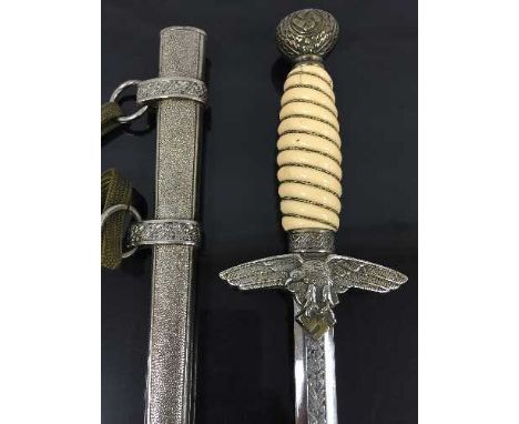 A German Third Reich Luftwaffe officer's dagger, in a pebbled effect plated scabbard with oak leaf decoration, with cream pla
