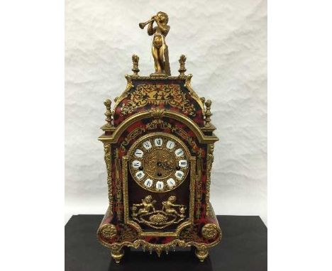 A nineteenth century style Boulle effect mantel clock, with key.