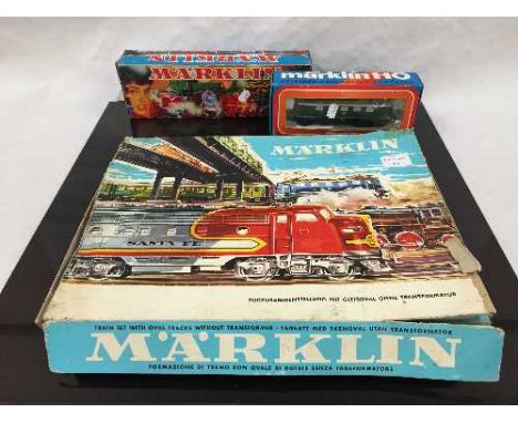A Marklin Oval-Track Train Set, together with two Marklin locomotives, numbers 3021 and 3037, all parts boxed. (3) 