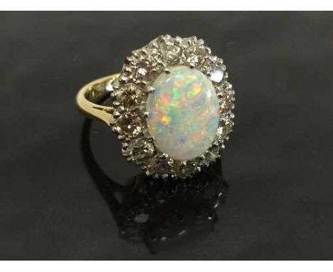 An 18ct gold opal and diamond cluster ring, size L.