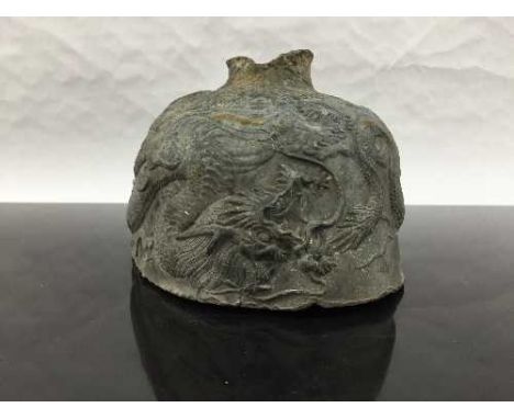 An eighteenth century Chinese bronze bell fragment, decorated with embossed dragons, width 14 cm. CONDITION REPORT: Sadly wit