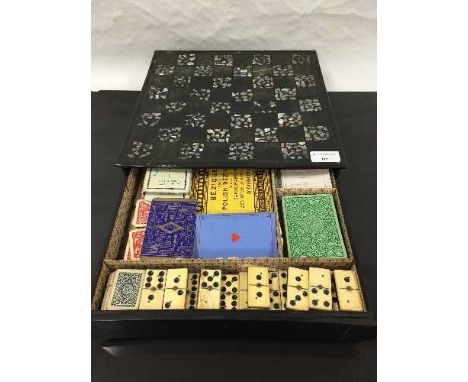 A Victorian papier mache and mother of pearl games box, circa 1880, with mother of pearl inlaid chessboard top, fitted with a