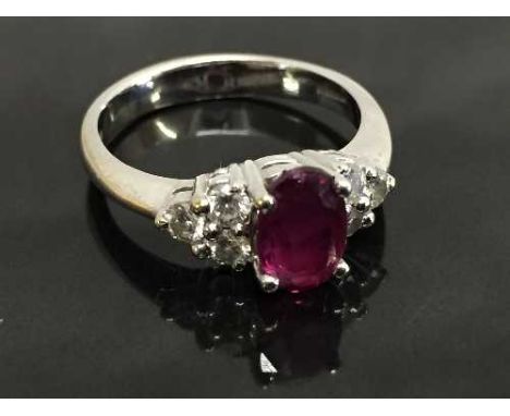 An 18ct white gold ruby ring, 1.82ct,  set with six diamonds to the shoulders, 0.44ct, size O.