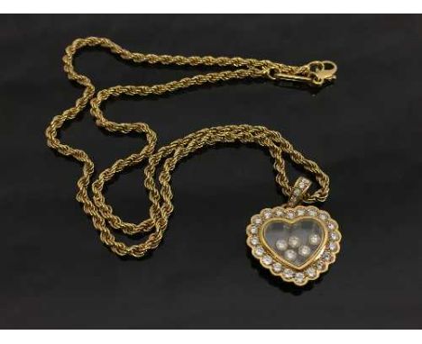 An 18ct gold Chopard Happy Curves diamond pendant on chain, 18.4g, with retail box and documents.