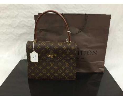 Louis Vuitton : A lady's Malesherbes hand bag, monogram canvas with tan trim, flap top with brass turn lock closure, with car