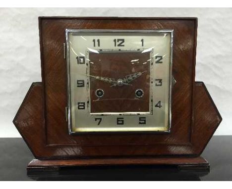 An Art Deco oak cased 8 day mantel clock, the square silvered dial with arabic numerals, striking on a gong, with key, height