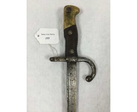 A French Gras bayonet, 52cm tapering blade and steel scabbard. CONDITION REPORT: Steel parts with typical aged pitting, sprin