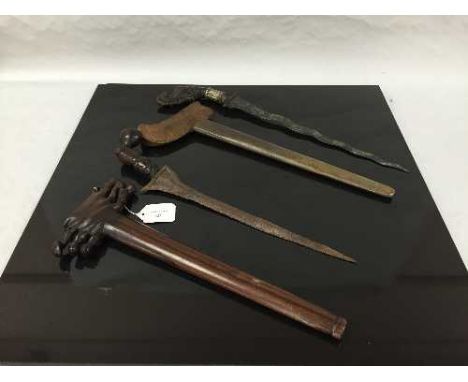 A Malayan kris dagger, with wavy watered steel blade and carved hardwood grip, in embossed brass scabbard. Together with anot