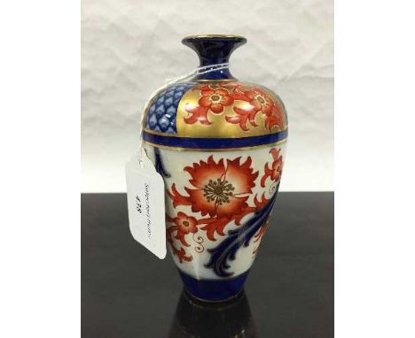 A James Macintyre Burslem ware vase, the ovoid crackle glaze body with painted floral decoration in red and gilt, marks to ba