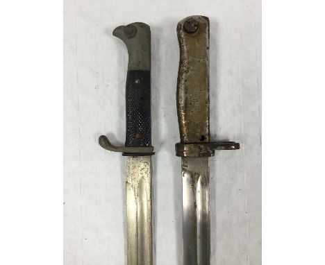 A scarce German steel hilted mauser bayonet,  together with a German parade bayonet. (2) CONDITION REPORT: Steel hilted bayon