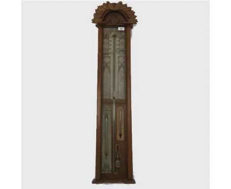 A nineteenth  century carved oak Admiral Fitzroy mercury barometer.