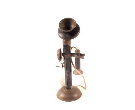 A tin plate stick telephone with bell