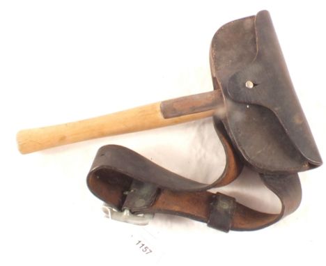 A firemans axe with leather sheath and belt