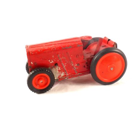 A tin plate clock work tractor with reg mark and licensed under patent