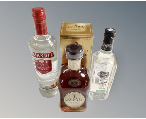 A bottle of Smirnoff triple distilled vodka, bottle of Cardau gold reserve single malt Scotch Whisky (boxed) a bottle of mint