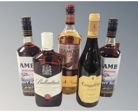 Two bottles of Lamb's Navy rum, bottle of Famous Grouse blended Scotch Whisky, bottle of Campo Viejo Garnacha 2017 and bottle