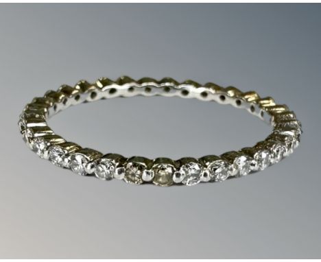 A platinum diamond full eternity ring, size J.