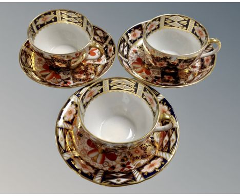 Three Royal Crown Derby Imari patterned tea cup and saucers, pattern number 2451, dated 1918