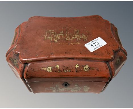 A late 19th century Chinese red lacquered tea caddy. (contents AF)