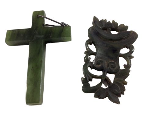 A jade cross together with a carved jade pendant. 