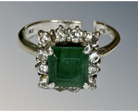 An 18ct white gold emerald and diamond ring, size N½. CONDITION REPORT: Shank is broken.